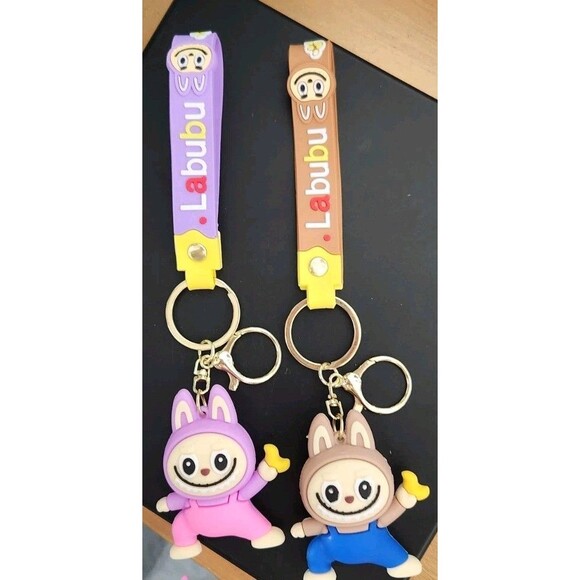 2 LABUBU Monsters Key Chains Anime Accessories - NWOT Purple Brown Backpack Clip - Picture 1 of 4